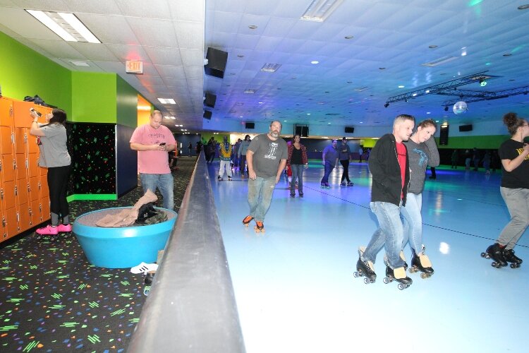 Skating enthusiast roller skate at RollXscape Skating Center’s grand opening in Holland Township, Nov. 4.