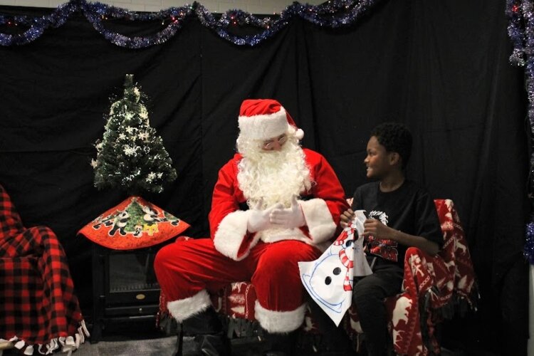 Nearly 80 children took part in this year's Signing Santa event. (DHHS)