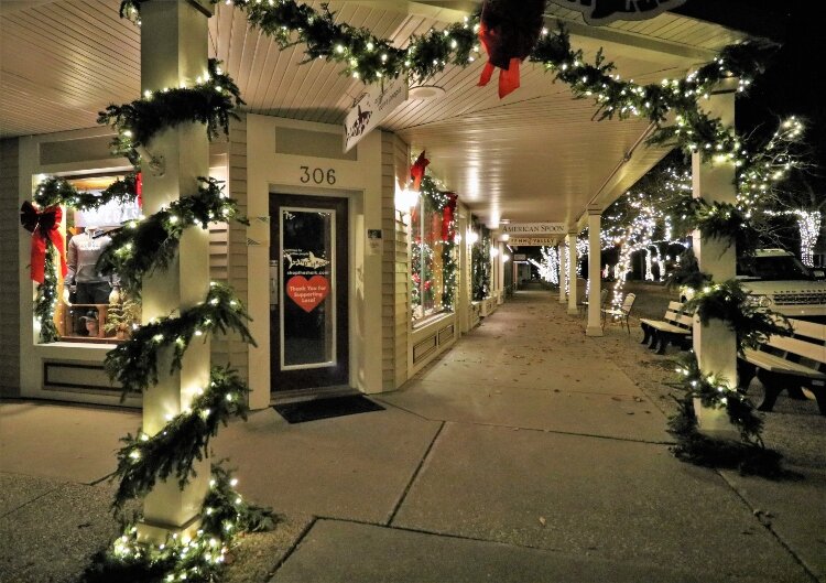 Downtown Saugatuck's storefronts don festive holiday decorations.