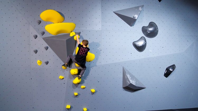 Shift Climbing's 12,377-square-foot facility features a first-in-the-nation hydraulically tiltable climbing structure, developed with European wall manufacturer Dreamwall.  