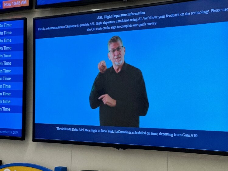 This video board piloted at Gerald R. Ford Internatonal Airport gives updates in American SIgn Language. 