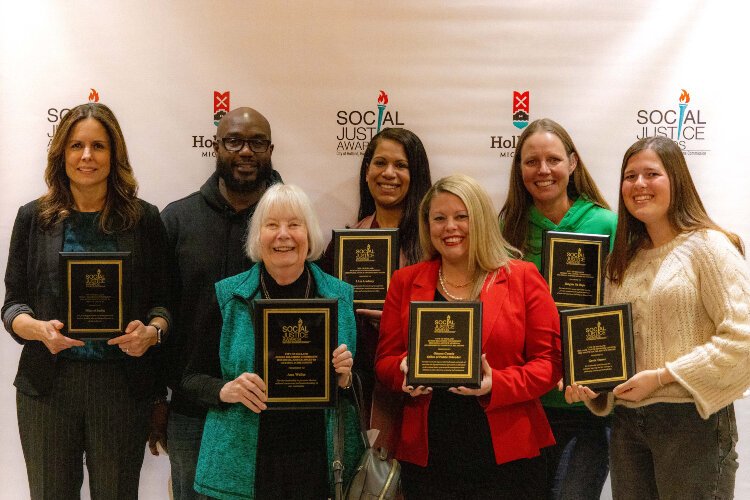 The 2022 Holland Human Relations Commission Social Justice Awards recipients pose for a picture after the awards ceremony.