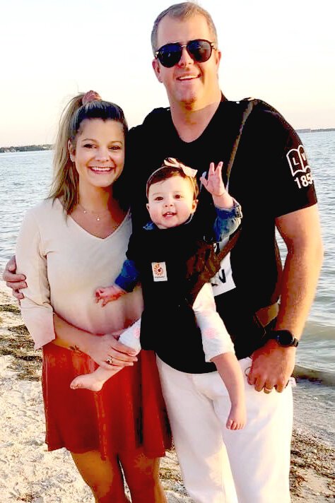 Jess and Skylar Garrison with their daughter, Rosemary. 