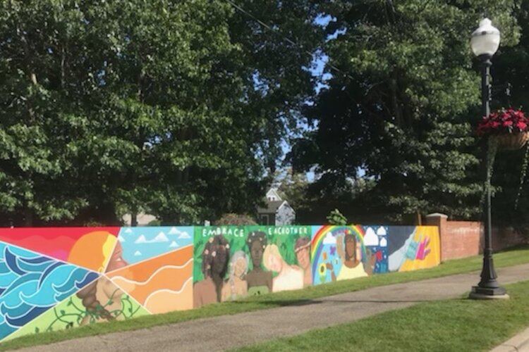 A mural on Central Park's west entrance wall in Spring Lake has the theme of supporting a diverse and inclusive world. 