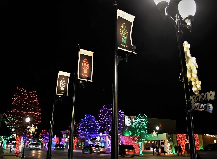 Decorated trees, buildings and light poles brighten up the sky above downtown Spring Lake.