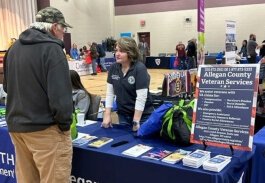 At the 2023 Allegan County Stand  Down event veterans visited various vendor booths receiving materials for the many services available.
