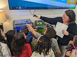 First grade students watch the making of a lion with a 3D printer in the STEAM lab. (MPS)