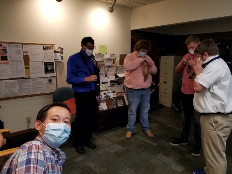 Disability Advocates of Kent County's Youth Transition Specialist Jon Cauchi showing some students how to tie ties before their mock interviews. (Disability Advocates of Kent County)