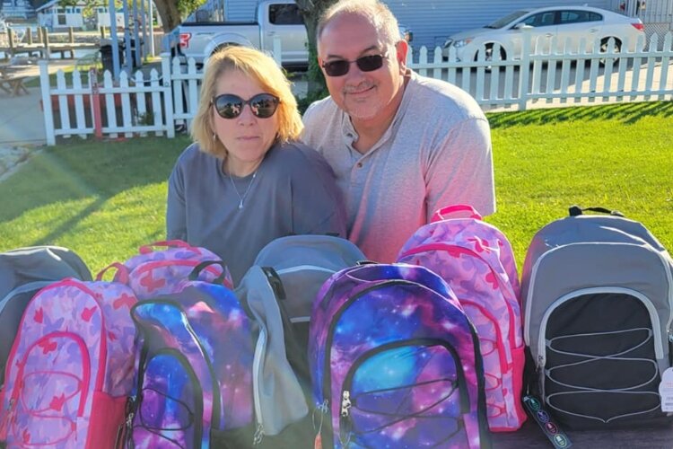 Long-distance boaters Greg and Susan Costa with their donations.