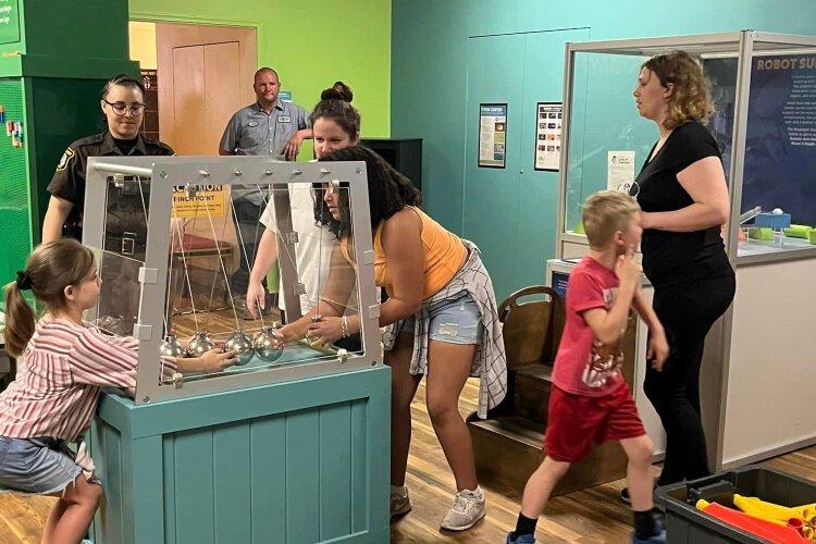A handful of Muskegon County Jail inmates and their families had private access to the Lakeshore Museum Center for their visit. 