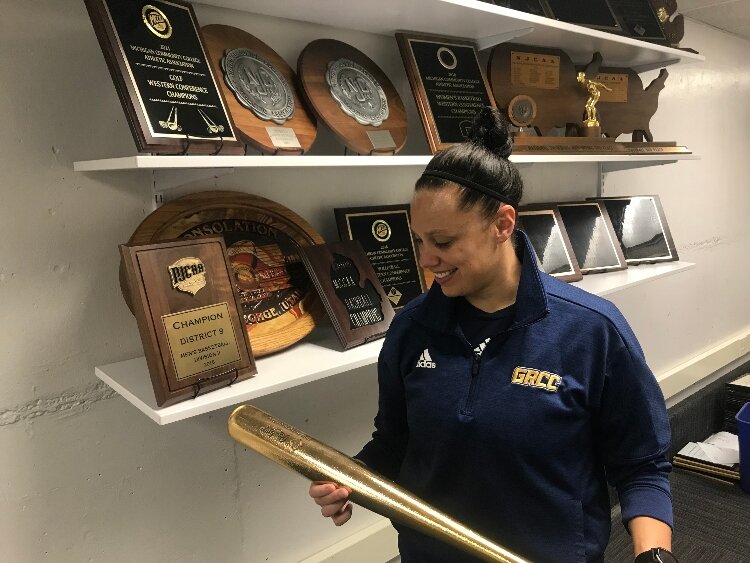 GRCC Whitney Marsh with a trophy.