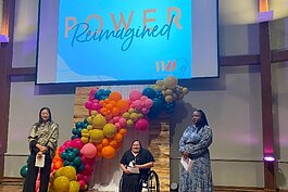 Women of Color Give founders Robyn Afrik, Lucia Rios and Yah-Hanna Jenkins Leys speak during the Power Reimagined event on Oct. 6. (Shandra Martinez)