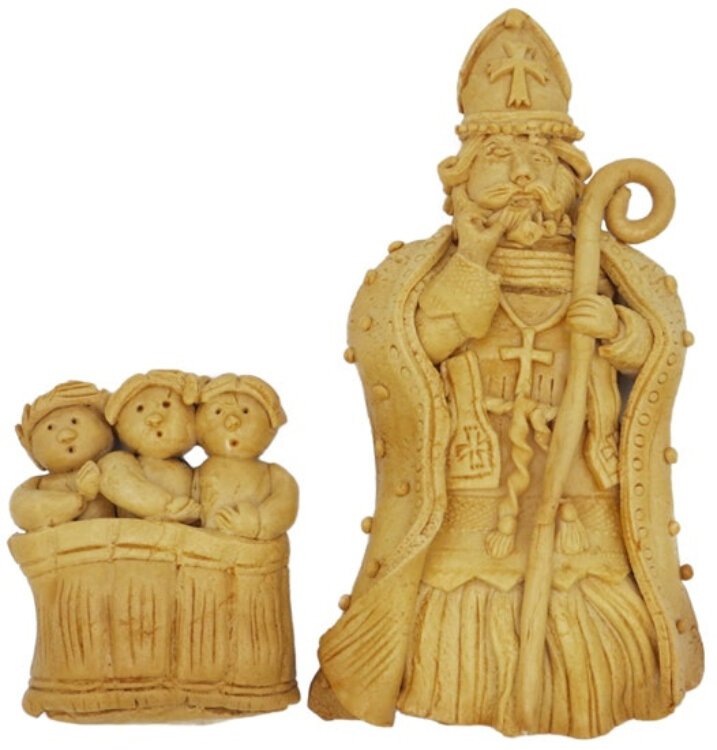 These unusual dough figures are from Lorraine, France. Such figures are common there and again show the children in the tub.