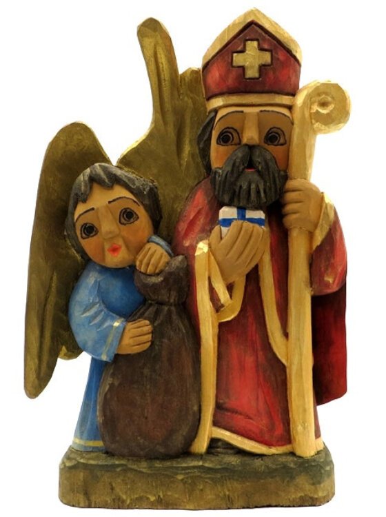Angels accompany St. Nicholas in Poland; carving by Andrez Wojtczak, Poland.