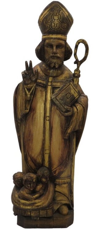 This antique wood carving probably came from a chapel in Belgium; it shows again the children St. Nicholas rescued.