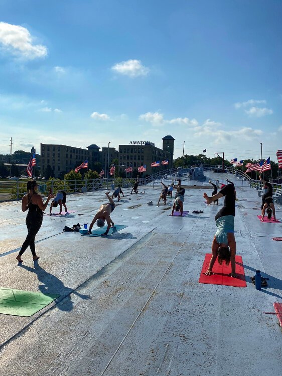 Yoga instructor Julia Fisher is passionate about the physical and mental benefits of yoga. She’s helping people find connection through yoga at several lakeshore studios.