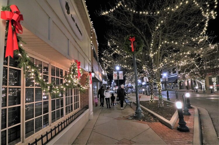 Decorated trees, storefronts, and window displays in downtown Zeeland announce the approaching Christmas holiday.