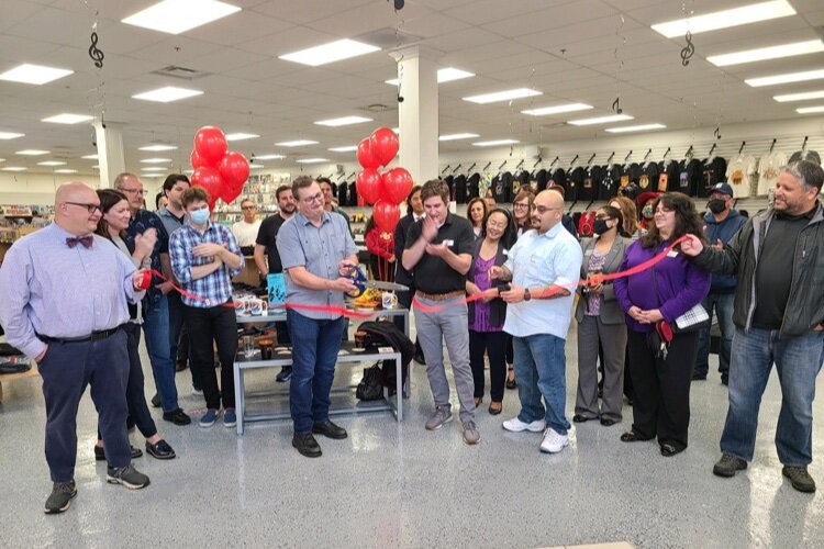 A ribbon cutting ceremony was held to celebrate the grand opening of Dearborn Music in downtown Farmington.