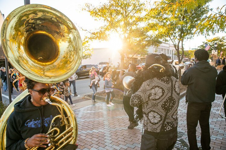 The Gabriel Brass Band leading revelers through downtown Farmington to open the Grand Raven Festival in October 2022.