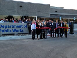 City officials cut the ribbon on the new DPW facility with the help of current and retired DPW employees and residents.