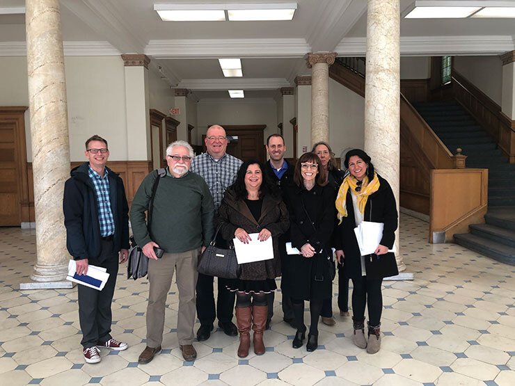 Anton Artspace steering committee in the lobby of the old St. Joseph Hospital on North Avenue,