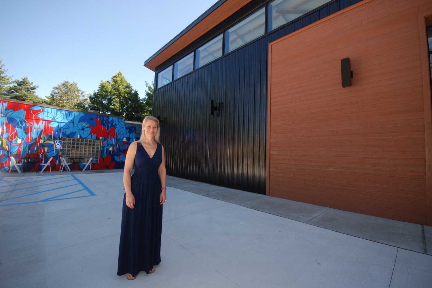 Epiphany Studios owner and master glassblower April Wagner proudly showing off the studio's new expansion.
