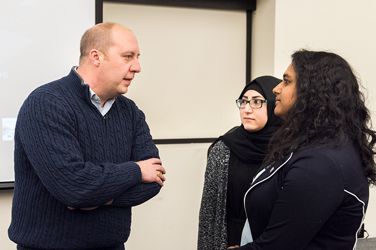 Michigan State Senator (23rd District) Curtis Hertel Jr  with U of M Dearborn student government vice president Malak Nasser and U of M Dearborn Student council president Fiana Arbab. Photo by Doug Coombe