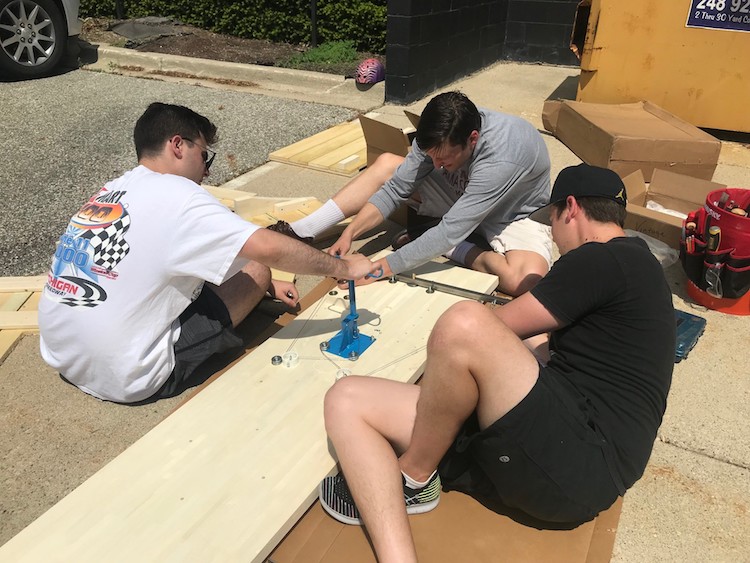 Dobrusin Law Firm employees build a test car for the Phoenix Derby Races