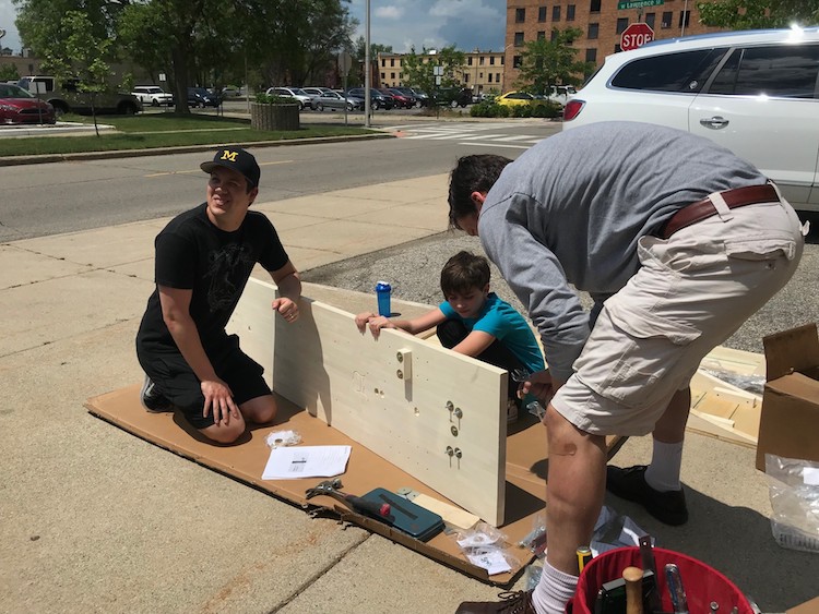 Dobrusin Law Firm employees build a test car for the Phoenix Derby Races