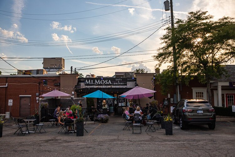 Downtown restaurants like MI.MOSA have made portions of their rear parking lots into pop-up patios