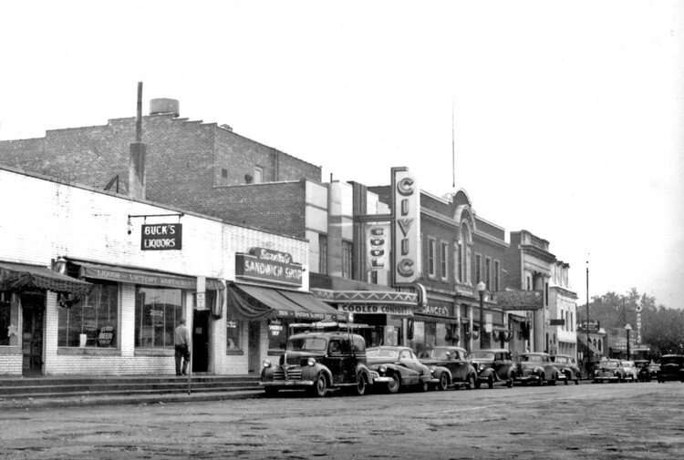 Classic 1940s automobiles outside of the theater in downtown Farmington