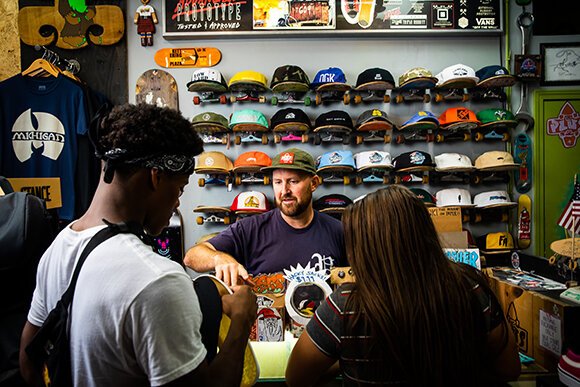 Rob Woelkers and customers at PLUSkateboarding. Photo by David Lewinski. 