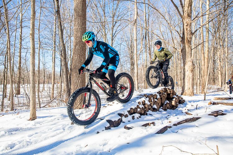 Fat-Tire Cyclists take to a ramp at River Bend Park.