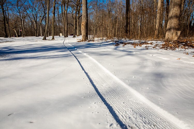 A freshly groomed track through the snow.