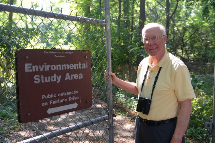 Dr. Orin Geldeloose has been teaching and the University of Michigan-Dearborn since 1969 and taking a walk along the river, can point out the most interesting layers of wildlife, from trees to birds. Photo by Jessica Strachan.