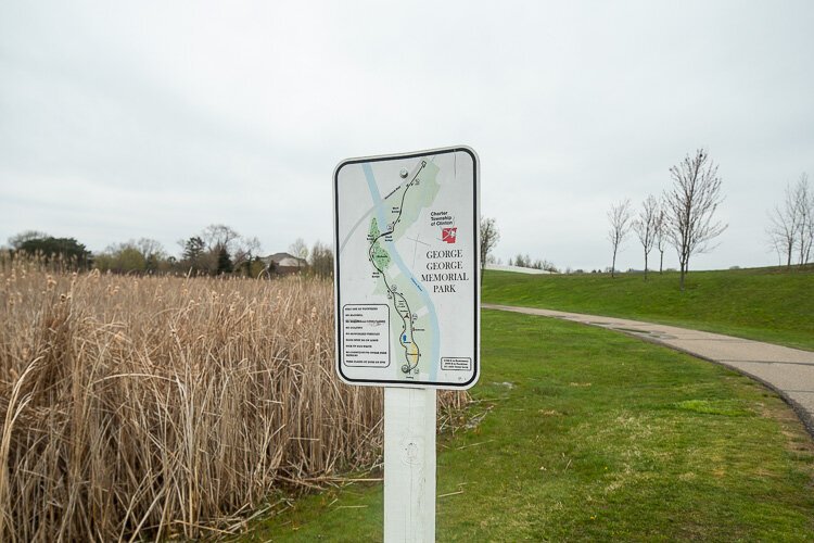 A trail with a map at George George Park. 