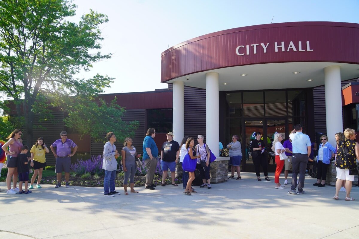 Residents, members of City Council and the CommUNITY Alliance gather for the ceremony.