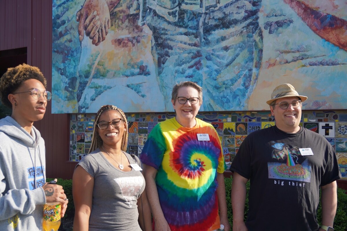 CommUNITY Alliance Vice-chair Cindy Bjornson (center) joins members Tatrika Graphenreed (left) and Michael Mazur (right).