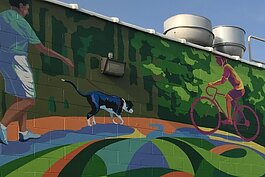 Detail from the Trailblazer mural from artist Wendy Popko aside Ventimiglia's Italian Foods. The scene depicts park life in Sterling Heights, a place where dogs have no shortage of places to explore.