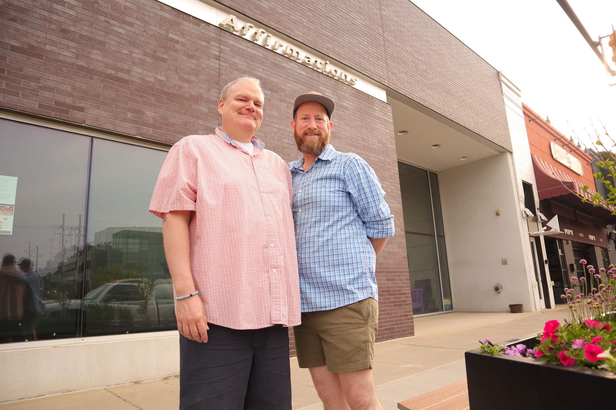 Artistic director Joe Bailey(left) stands beside his husband and theater co-founder Brandy Joe Plambeck(right). Plambeck is the media director for The Ringwald Theatre. 