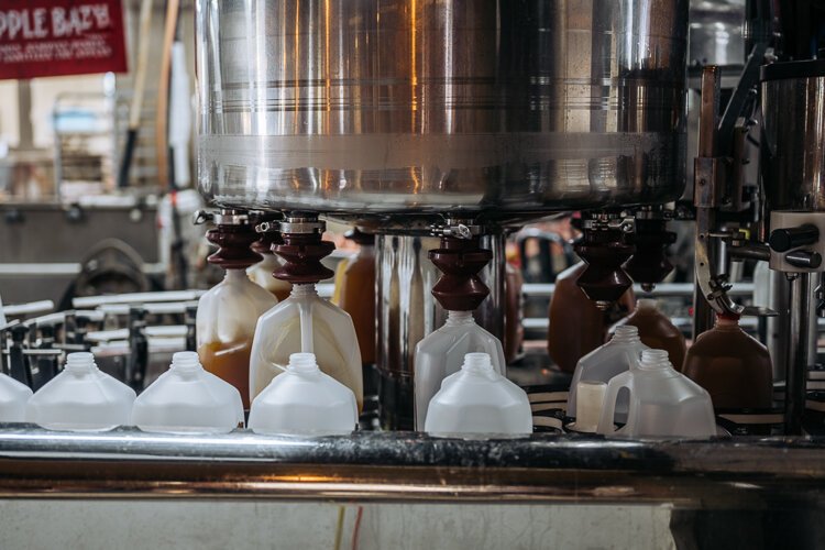 A machine fills cartons with cider at Blake's Orchard.