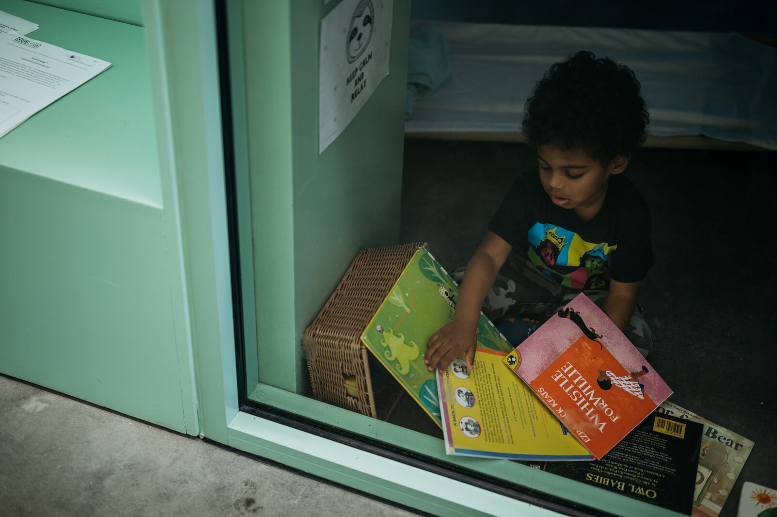 A child independently looks at books during quiet time.