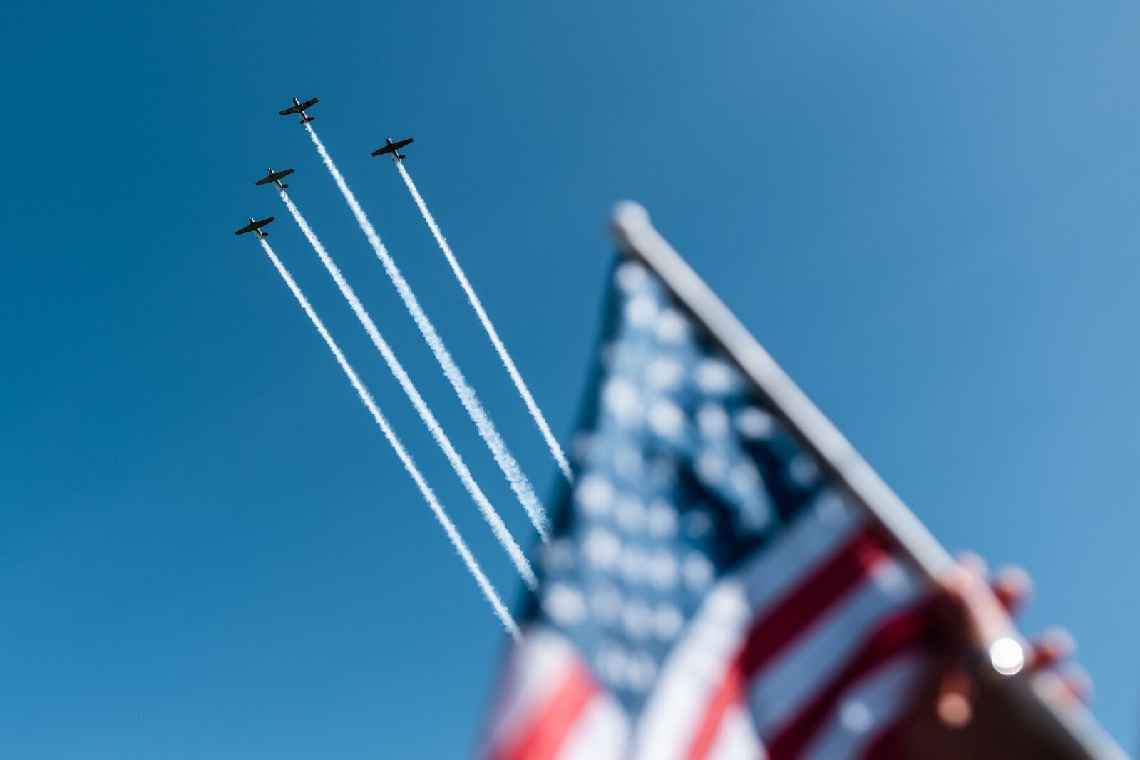 A flyover from the legendary Tuskegee Airmen in their WWII-era planes.