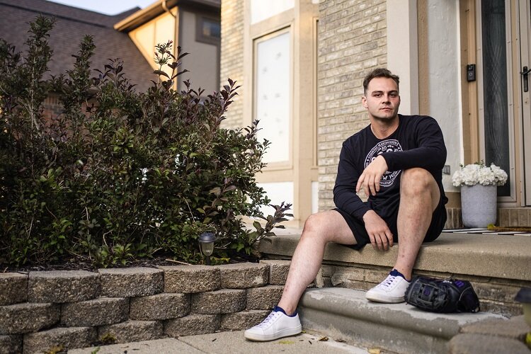 Cal Coughlin on the porch of his host family's home.