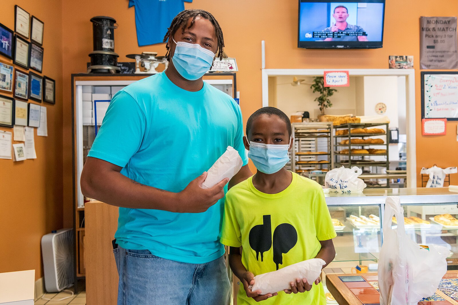 Customers Jayson and Genesis Shaw at Capri Italian Bakery. Photo by Doug Coombe.