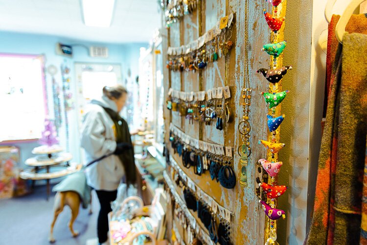 A shopper checks out what available at Kitty Deluxe.