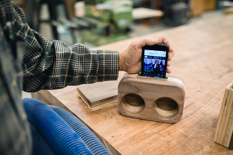 Mike McDermott demos his boombox of wood.