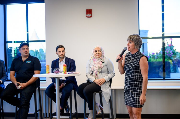 Cristina Sheppard-Decius, from the Dearborn Downtown Development Authorities begins panel discussions at the Dearborn Open City. Dearborn, Michigan. Septemeber 26th, 201