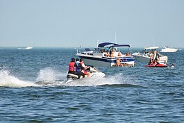 Jet skiers and boat enthusiasts enjoy the waters of Lake St. Clair.