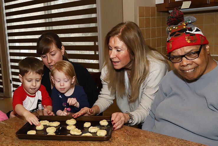 Julie Rosenbaum with Pearl and Simon Rosenbaum and Randi Sakwa with a client at the JARC Nusbaum house. Photo courtesy Jewish Community Relations Council.